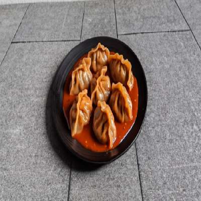 Pan Tossed Mushroom Momo In Szechuan Sauce [8 Pieces]