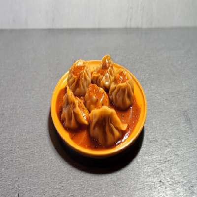 Pan Tossed Chicken Momo In Chilli Sauce [8 Pieces]
