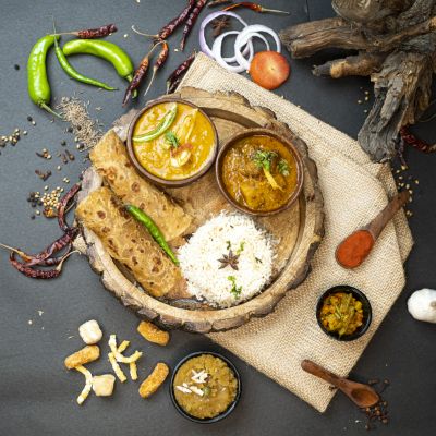 Yellow Dal Tadka, Bhuna Aloo Masala, 6 Paranthas, Jeera Rice, Homemade Pickle, Desi Ghee Halwa