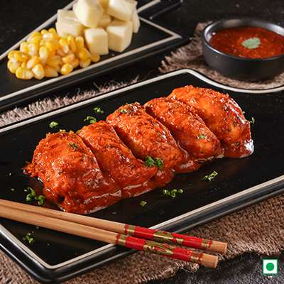 CORN CHEESE PAN FRIED MOMO IN SCHEZWAN SAUCE