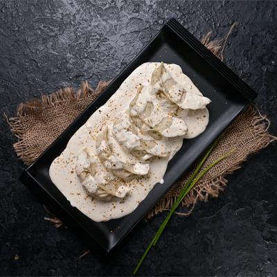 Chicken Darjeeling Momo in Molten Cheesy Sauce