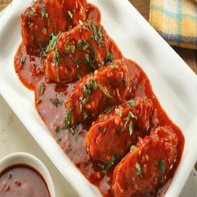 Chicken Darjeeling Pan Fried Momo in Tomato Garlic Sauce
