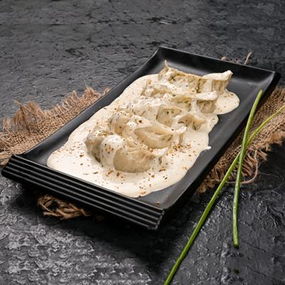 Veg Darjeeling Momo in Molten Cheesy Sauce