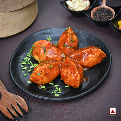 Chicken Pahari Feast Pan Fried Momo in Schezwan Sauce(Spicy)