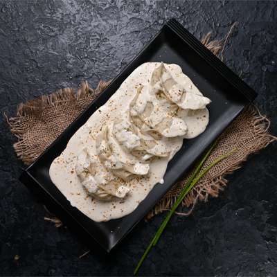 Chicken Darjeeling Momo Momo in Molten Cheesy Sauce