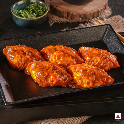 Chicken Masala Pan Fried Momo in Schezwan Sauce(Spicy)