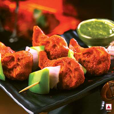 CHICKEN TANDOORI MOMO