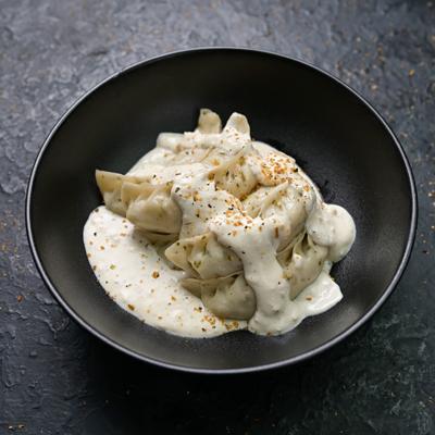 Chatpata Paneer  Momo in Molten Cheesy Sauce