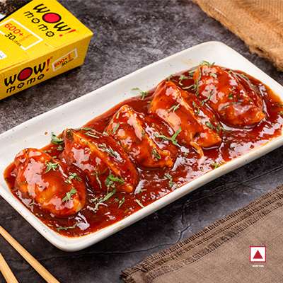 Chicken Delight Pan Fried Momo in Schezwan Sauce (Spicy)