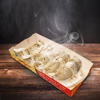 Chicken Masala Momo in Molten Cheesy Sauce