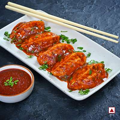 CHICKEN PAHARI FRESH PAN FRIED MOMO IN SCHEZWAN SAUCE