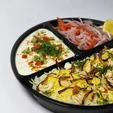 Awadhi Biriyani Served With Raita, Onion